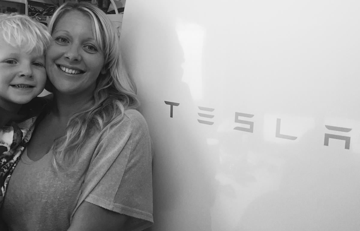 tesla-powerwall-family-photo Happy Solar storage family