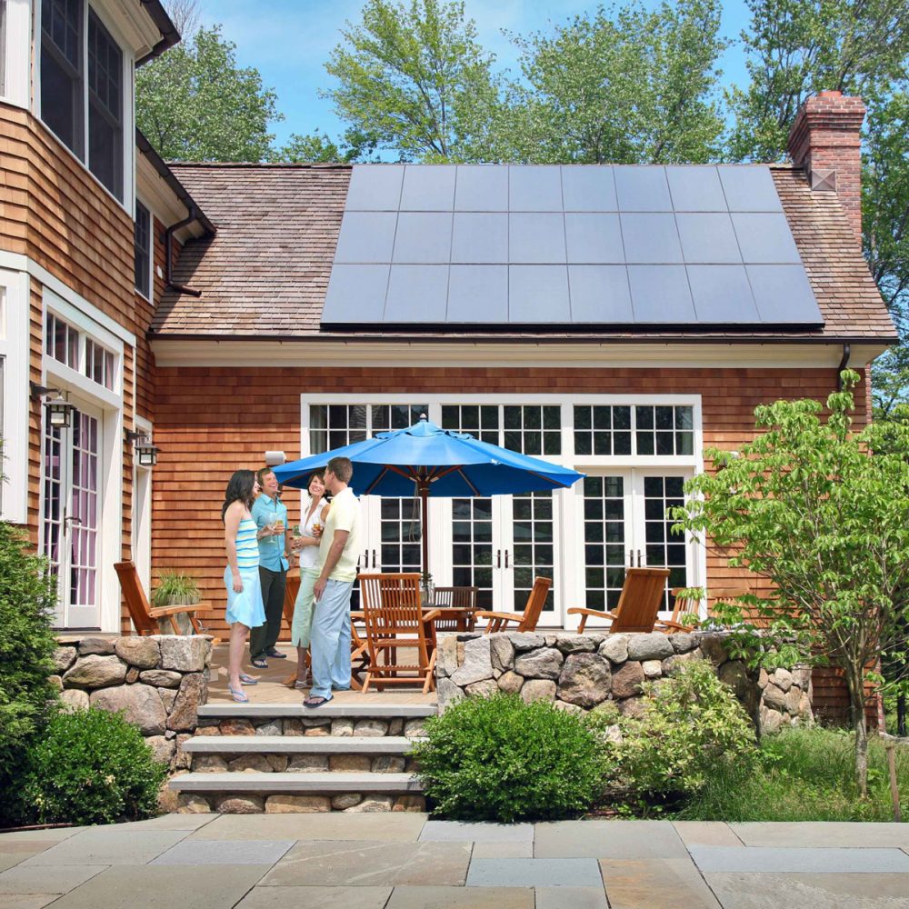 patio-house-people-sm-sq People on a patio outside a house with solar panels